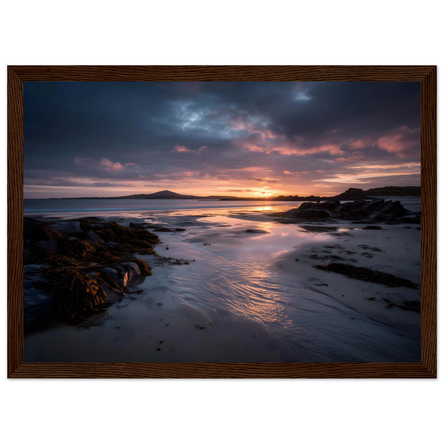 Violet and gold coastal sunset poster in a dark brown wood frame