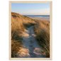 Sand track through amber marram grass to an empty beach at golden hour, print in a natural light wood frame