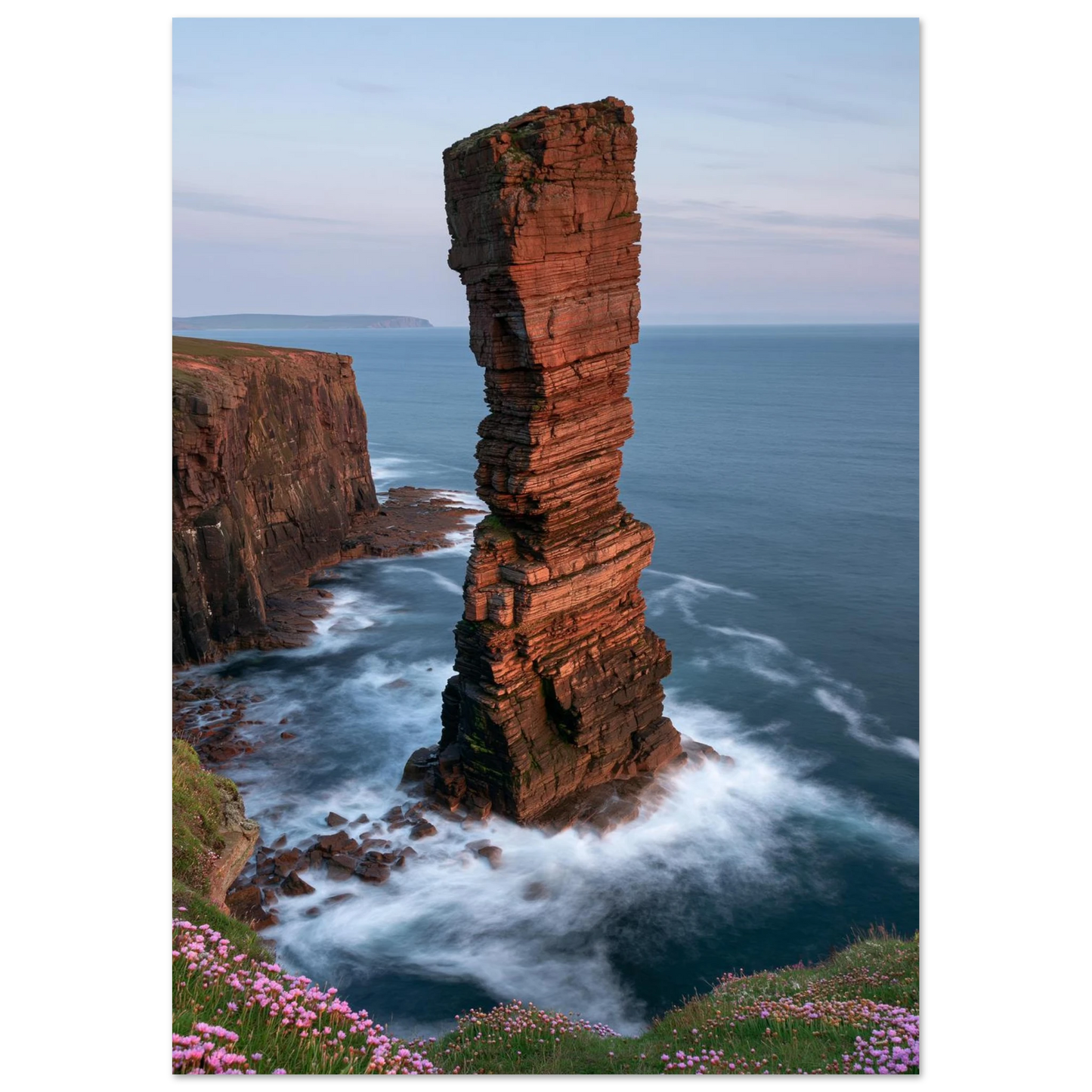 Red sandstone sea stack at last light with white water swirling at its base, unframed print