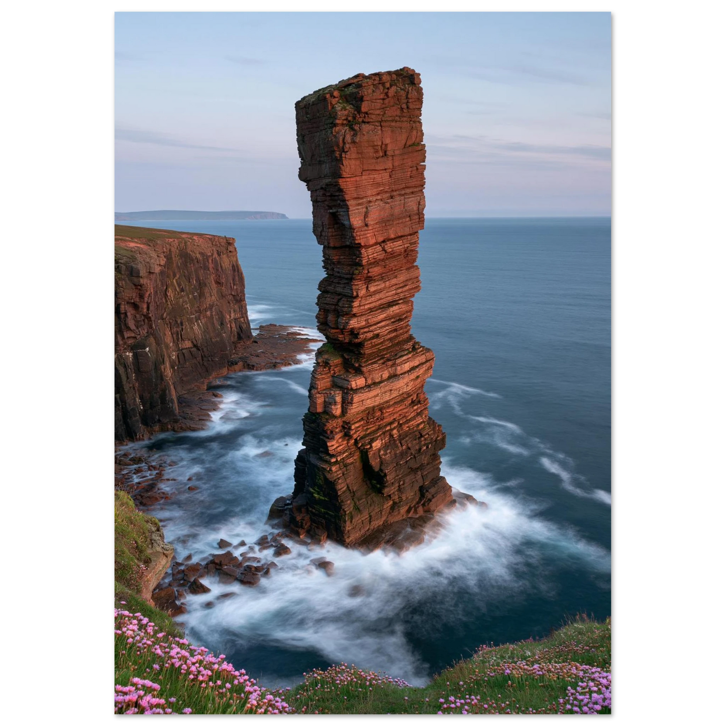 Red sandstone sea stack at last light with white water swirling at its base, unframed print