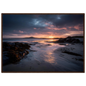 Dramatic coastal sunset print in a warm brown wood frame