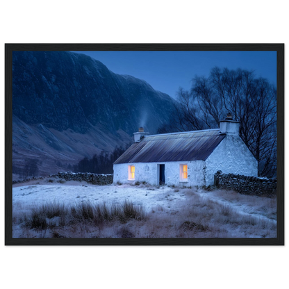 Blue hour Scottish croft with lit windows, framed in charcoal