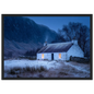 Blue hour Scottish croft with lit windows, framed in charcoal
