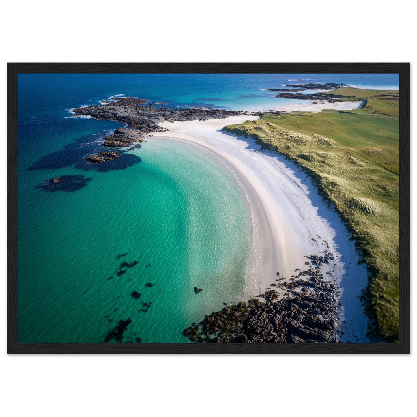 Turquoise Hebridean shallows and dark rock, print in a dark grey frame