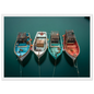 Overhead view of four painted fishing boats on dark green water, framed in white with a wide mount