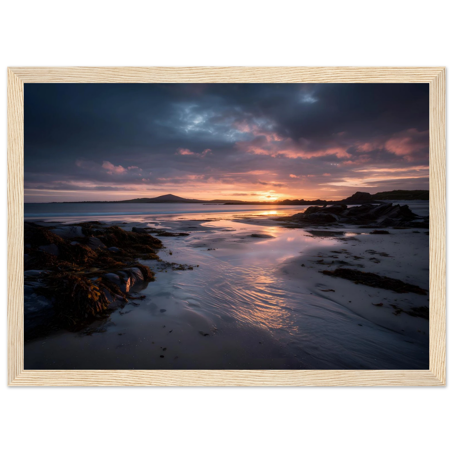 Moody beach sunset at low tide, art print in a pale natural wood frame