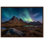 Green aurora above a Highland peak and heather foreground, in a dark brown wood frame