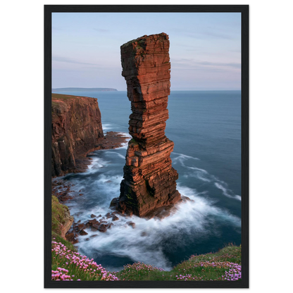 Red sandstone sea stack at last light above an Atlantic cliff coast, print in a black frame