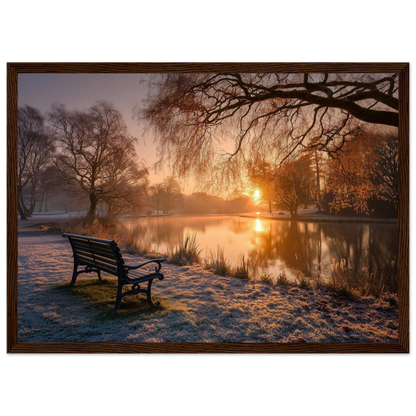 Frosted park lake at winter sunrise with an empty bench on the bank, print in a dark brown wood frame