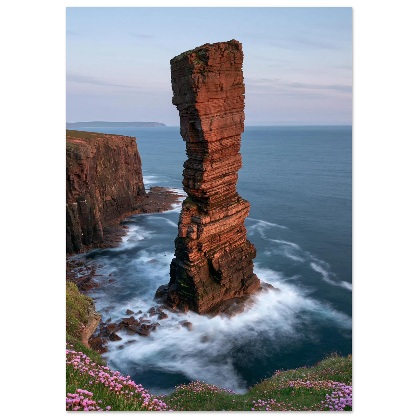 Red sandstone sea stack at last light with white water swirling at its base, unframed print