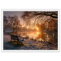 Frosted park lake at winter sunrise with an empty bench on the bank, print in a white frame