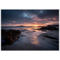 Low tide beach at sunset with seaweed rocks, framed in dark grey