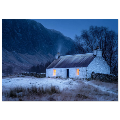Cottage windows glowing in a snowy glen, print in a pale wood frame