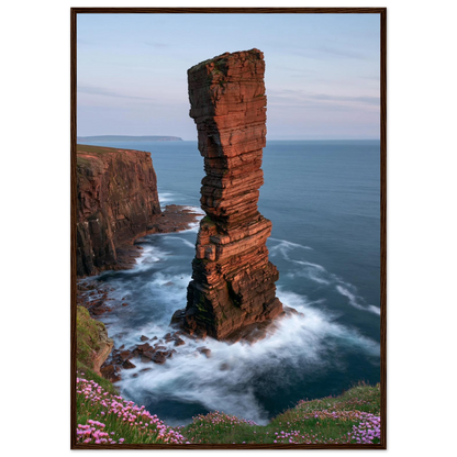 Red sandstone sea stack at last light above an Atlantic cliff coast, print in a dark brown wood frame