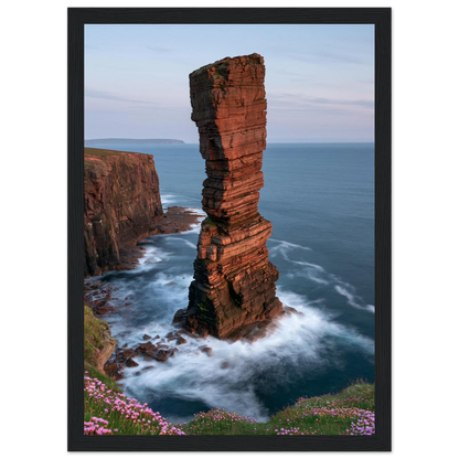 Red sandstone sea stack at last light above an Atlantic cliff coast, print in a black frame