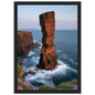Red sandstone sea stack at last light above an Atlantic cliff coast, print in a black frame