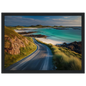 Single-track road above a white sand beach, framed in black