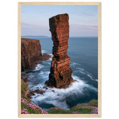 Red sandstone sea stack at last light above an Atlantic cliff coast, print in a natural light wood frame