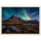 Green and violet northern lights over a Highland glen, framed in pale natural wood