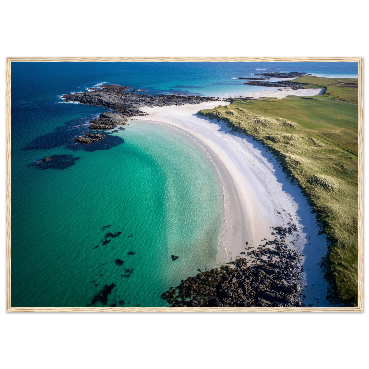 Aerial coastal scene in turquoise, white and green, print in a dark frame