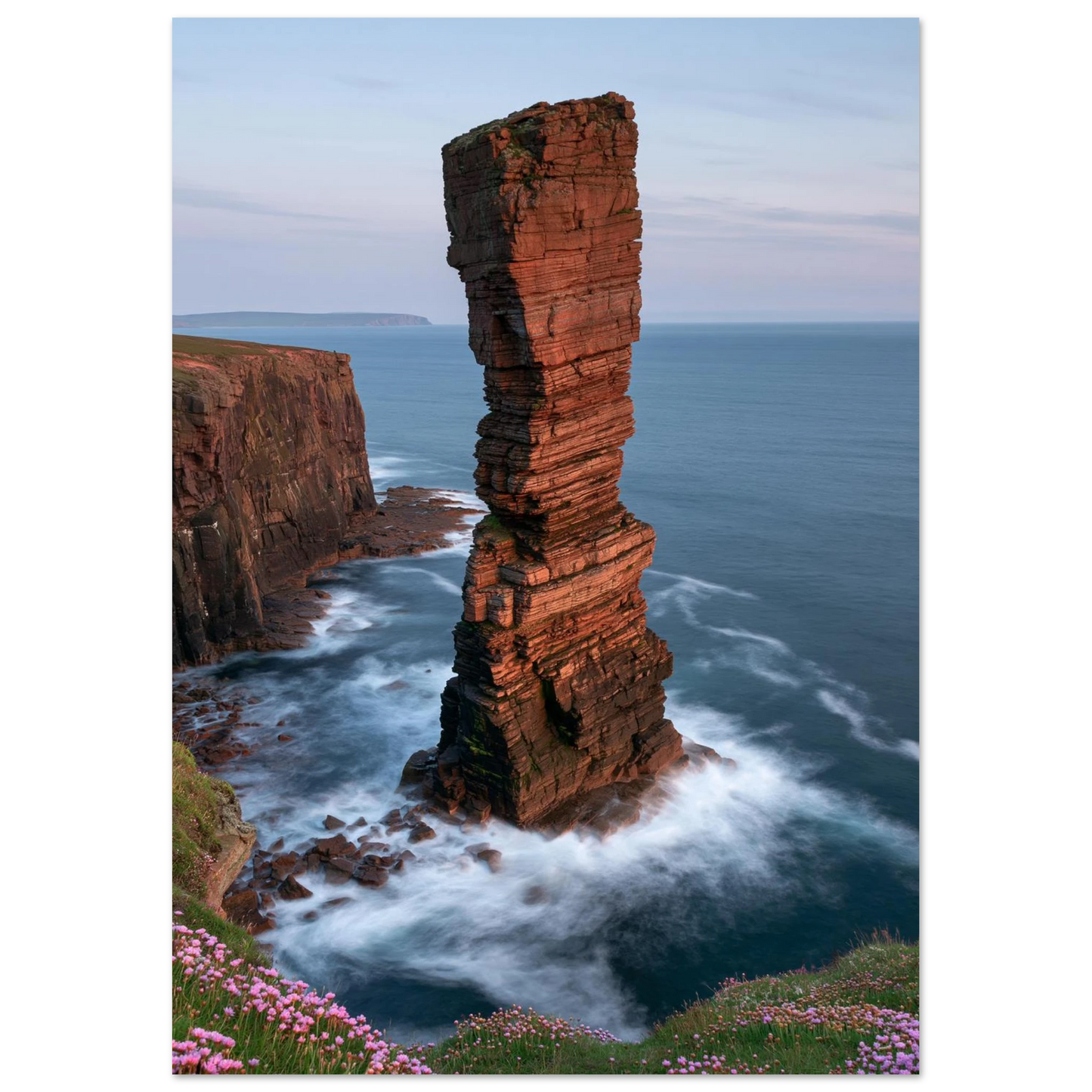 Red sandstone sea stack at last light with white water swirling at its base, unframed print