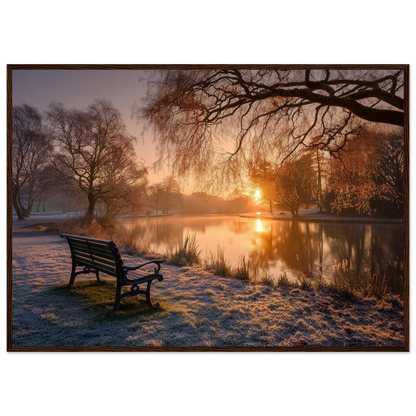 Frosted park lake at winter sunrise with an empty bench on the bank, print in a dark brown wood frame