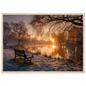 Frosted park lake at winter sunrise with an empty bench on the bank, print in a natural light wood frame