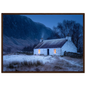 Snowy Highland cottage at blue hour, in a warm brown wood frame