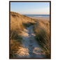 Sand track through amber marram grass to an empty beach at golden hour, print in a dark brown wood frame