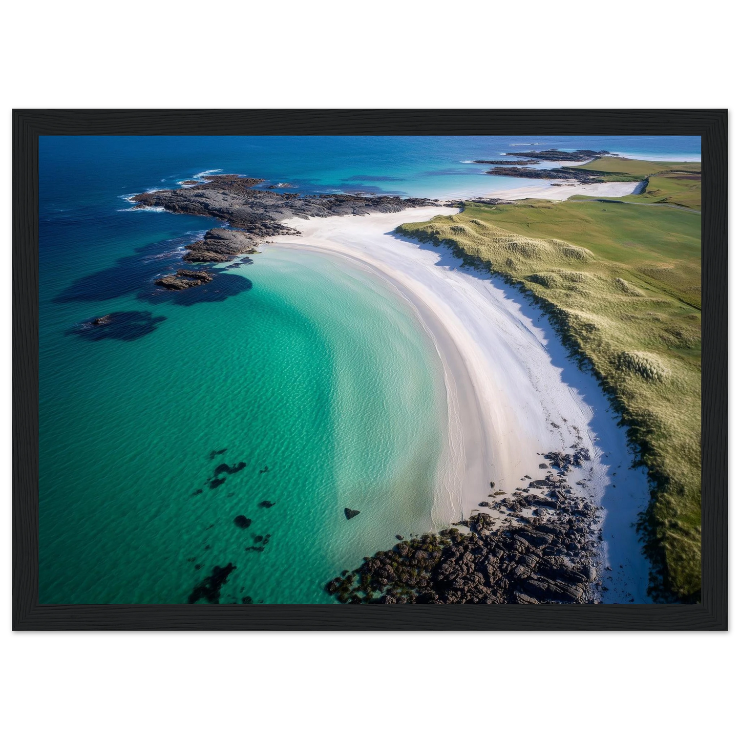 Turquoise shallows meeting white shell sand, framed in black