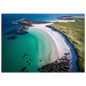 Aerial view of a curved white shell-sand beach with turquoise shallows, dark rocks and green machair, print in a slim dark frame