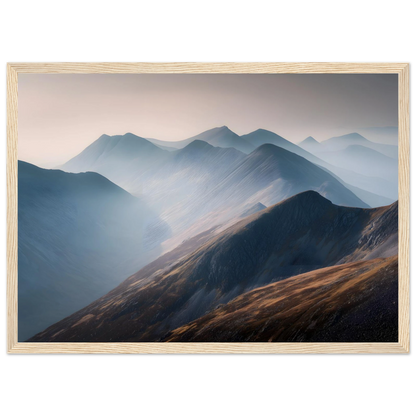 Misty mountain ridges wall art in a pale wood frame with a wide mount