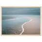 Muted coastal scene at low tide, framed in light oak