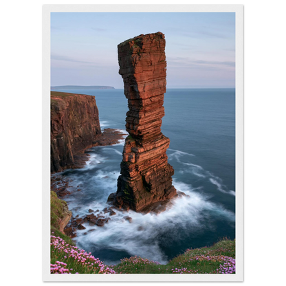 Red sandstone sea stack at last light above an Atlantic cliff coast, print in a white frame