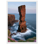 Red sandstone sea stack at last light above an Atlantic cliff coast, print in a white frame