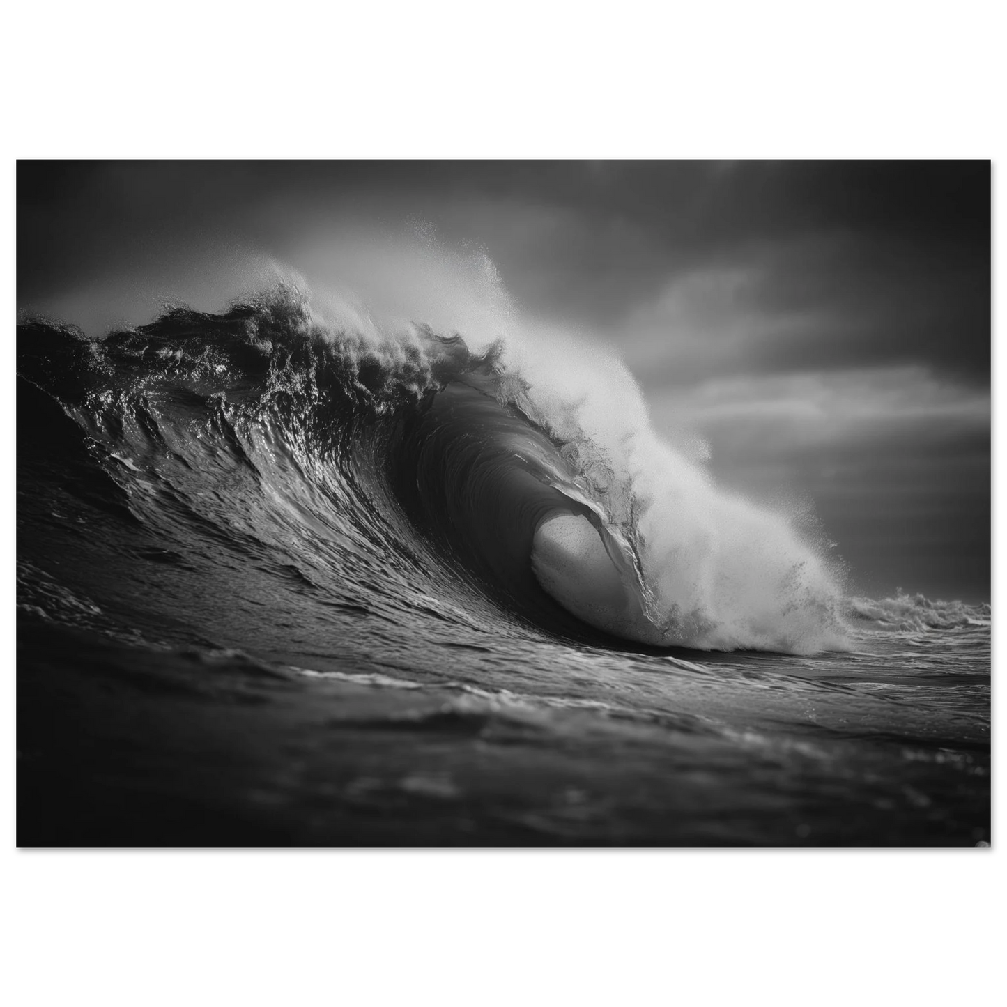 A breaking ocean wave curling into a barrel with light glowing through the lip, black and white, print in a slim dark frame