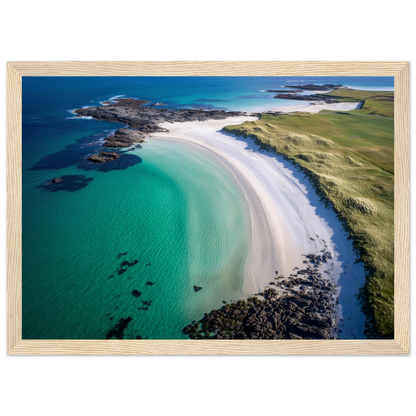 Curved beach and green machair from above, framed in pale oak with a wide mount