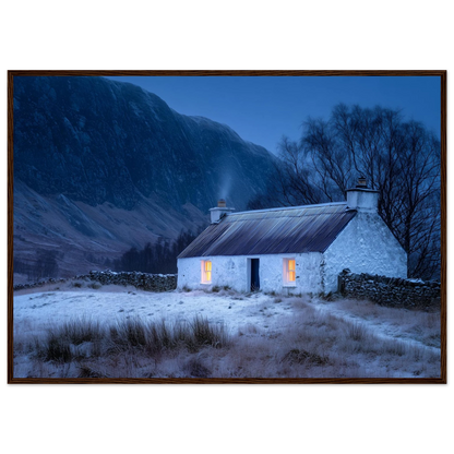 Snowy Scottish croft at dusk, framed print in a dark red-brown wood frame