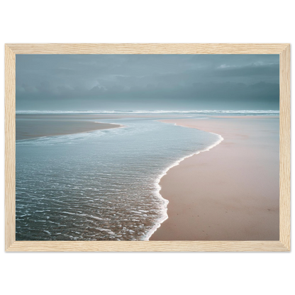 Quiet beach and shallow surf under a grey sky, framed in light natural wood