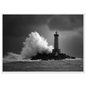 Lighthouse and breaking wave, monochrome print in a white frame with a wide mount