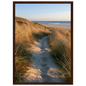 Sand track through amber marram grass to an empty beach at golden hour, print in a dark brown wood frame