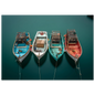 Four small fishing boats on their moorings seen from above, blue, white, turquoise and red hulls on flat dark water, print in a slim dark frame