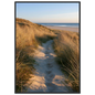 Sand track through amber marram grass to an empty beach at golden hour, print in a black frame