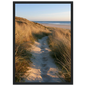 Sand track through amber marram grass to an empty beach at golden hour, print in a black frame