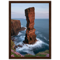 Red sandstone sea stack at last light above an Atlantic cliff coast, print in a dark brown wood frame