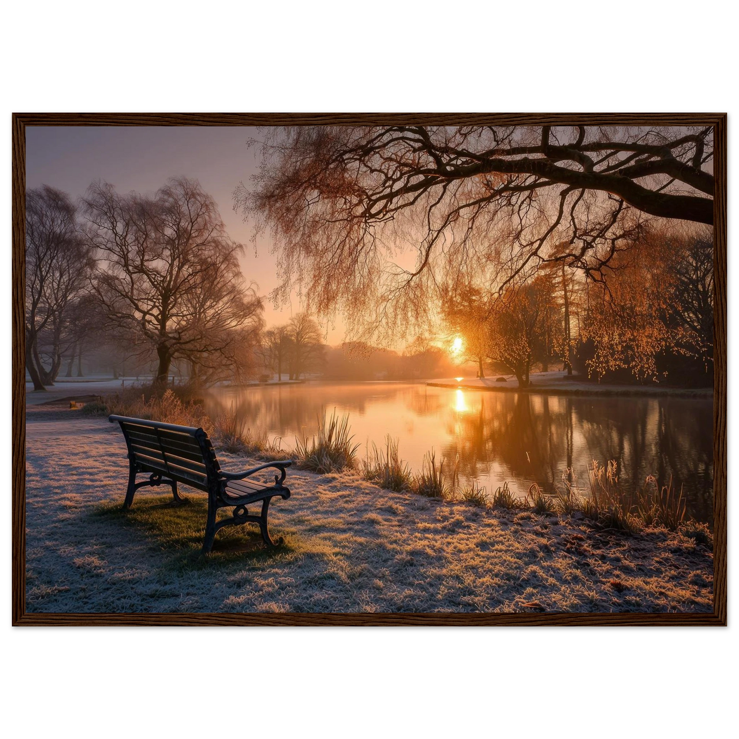 Frosted park lake at winter sunrise with an empty bench on the bank, print in a dark brown wood frame