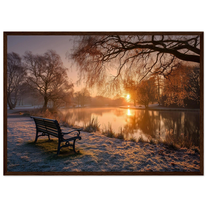 Frosted park lake at winter sunrise with an empty bench on the bank, print in a dark brown wood frame