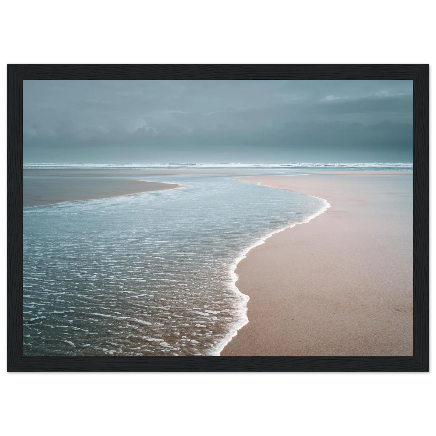 Empty beach at the water's edge, print in a black frame with a wide mount