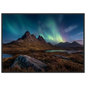 Northern lights above a Scottish mountain and loch, framed in dark grey