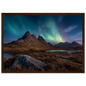 Aurora over a Highland loch with rocky foreground, framed in dark brown wood